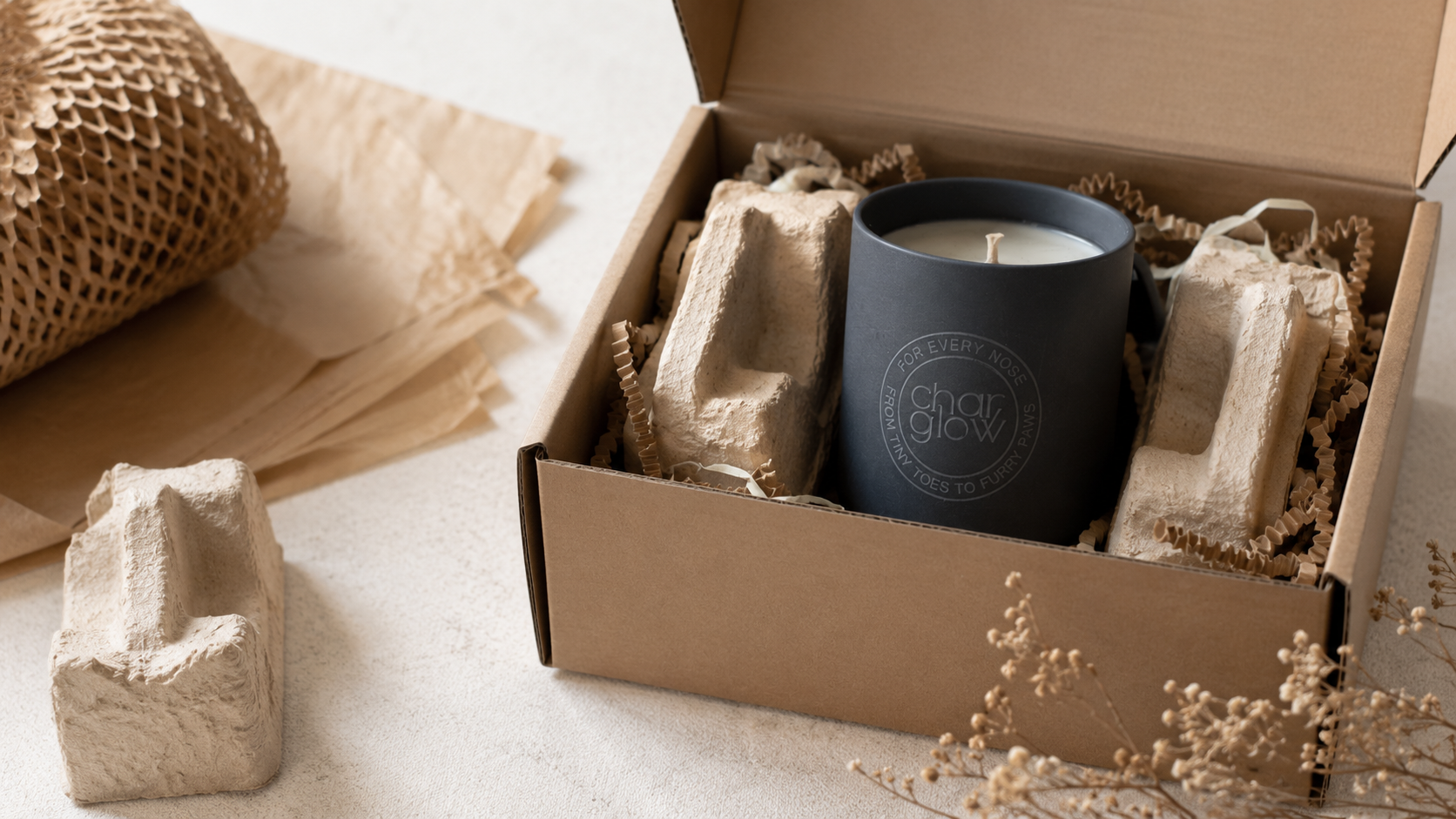 CharGlow ceramic candle with mushroom-based protective packaging in an open shipping box